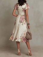 Alba - Elegancka midi sukienka w retro stylu z satynowym kwiatowym motywem